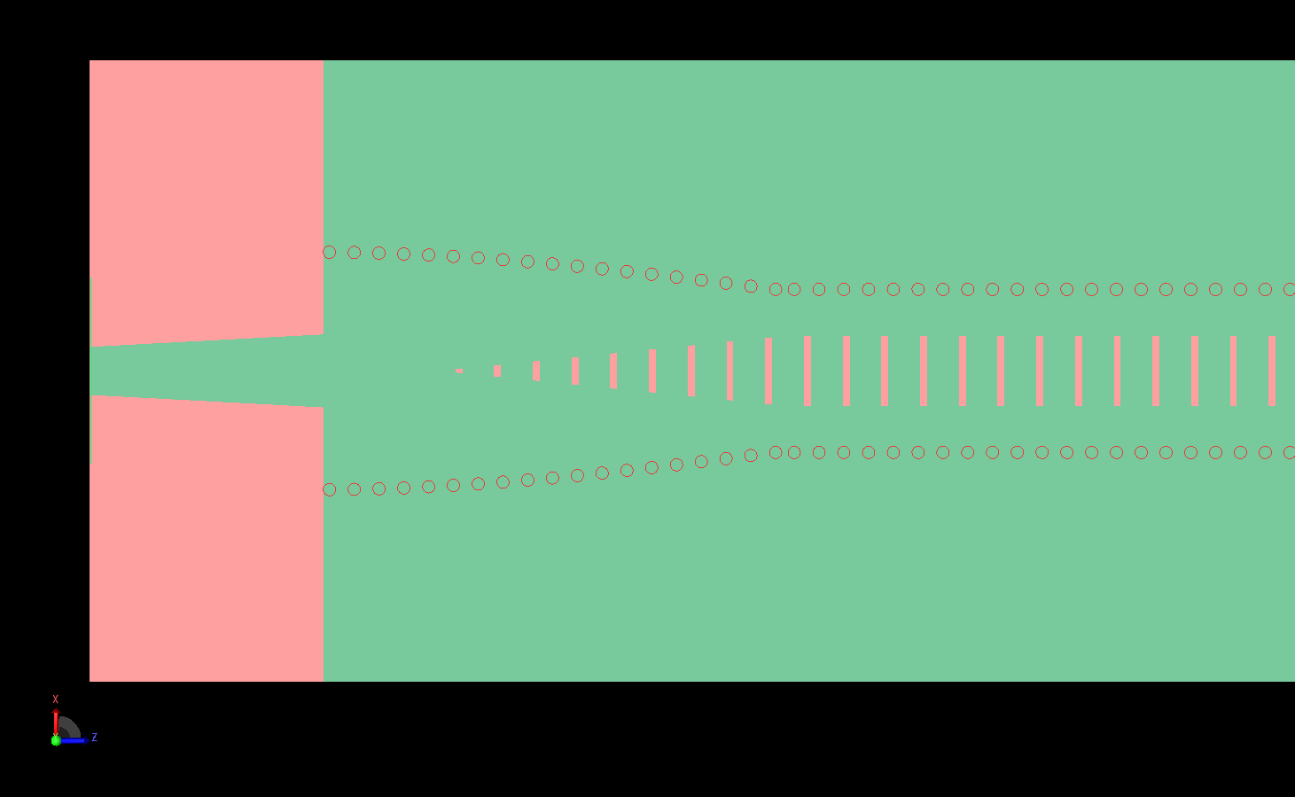 図2：アンテナの一端を詳細に見ると、テーパー状のスロットとマイクロストリップ線路の下に位置するカーブしたビアパスがわかる。